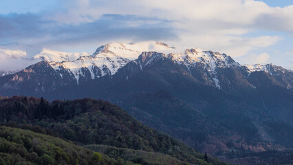 Fototapeta premium Bucegi mountains in the spring at sunset, view from the city of Rasnov in Romania Transylvania