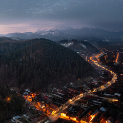 Dramatic aerial view of a road in Rasnov, Transylvania, at sunrise 