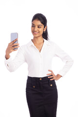 Young business woman taking selfie isolated on white.