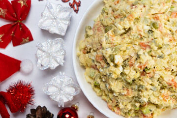Olivier Russian salad on a Christmas and New Year background, top view.