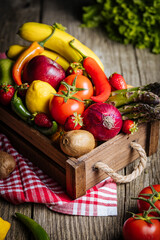 Basket full of fresh fruit and vegetables. Colourful and vibrant. Seasonal ripe