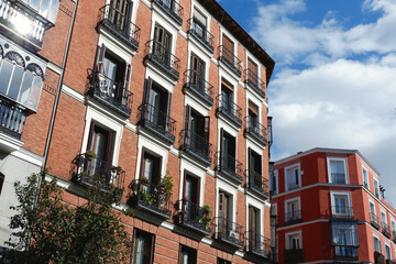 Fototapeta na wymiar Traditional housing buildings in Chueca district in Madrid, Spain