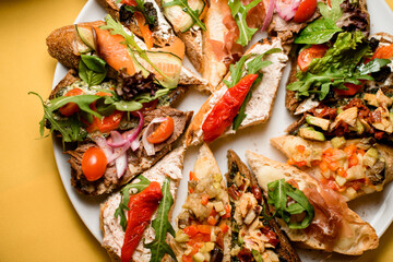 Plate with snacks. Healthy mix of seafood, vegetables, salad and creamcheese. Top view