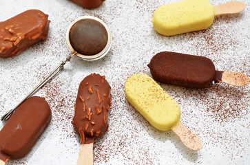 ice cream in white, milk and dark chocolate glaze