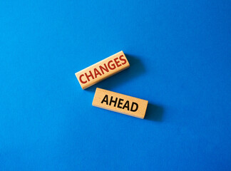 Changes ahead symbol. Wooden blocks with words Changes ahead. Beautiful blue background. Business and Changes ahead concept. Copy space.