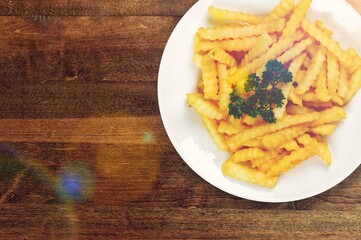 Roasted tasty fry potatoes on desk