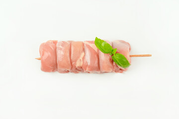 Chicken skewers.Food for retail.Skewers from raw chicken leg meat without skin for a supermarket on a white background.Chicken meat.Procurement for designers.