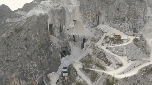 Closeup drone shot of marble quarry on mountainside in Carrara, Italy