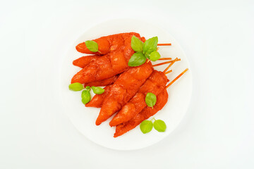 Fresh raw marinated chicken meat skewers iner fillet on a white background.Top view.Copy space.Closeup of chicken meat.Chicken breast inner Fillets.Marinated Chicken skewers fillet meat.