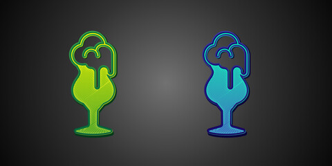 Green and blue Glass of beer icon isolated on black background. Vector