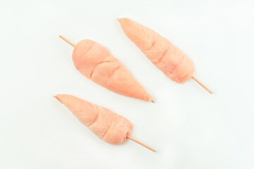 Chicken skewers.Food concept.Skewers from raw chicken meat inner fillet for supermarket on a white background.Ogranic food,healthy eating.Food for retail.Top view.Raw Chicken breast Fillets.