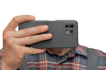 Hand of a man in shirt close-up holding a mobile phone or smartphone in a grey case on a white background, isolated