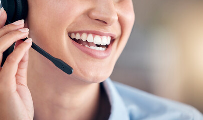Cropped Close Up of a unknown smiling mixed race call centre agent talking to customers with a...