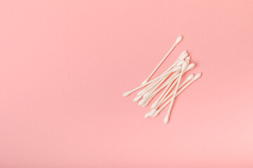 Eco-friendly cotton swab, bamboo cotton buds on a pink background. Waste-free cosmetics without plastic. Eco goods. hygiene. Place for text. Place to copy.