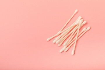 Eco-friendly cotton swab, bamboo cotton buds on a pink background. Waste-free cosmetics without plastic. Eco goods. hygiene. Place for text. Place to copy.