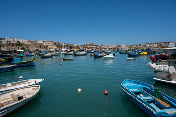 Fototapeta na wymiar Fishing boats in the Marsaxlokk, Malta