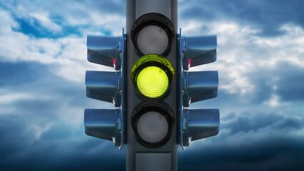 Traffic lights with changing colors against sky with clouds