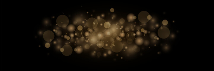 Dust and sparks and golden stars shine with a special light. Vector sparkles on a black background. Christmas light effect. Shiny magical dust particles.