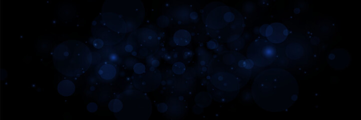 Bokeh particles, abstract background with shiny dust on black background.