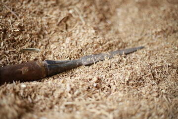 wood carving tools with sawdust