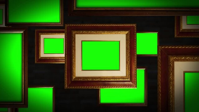 Picture frames with green chromakey space hang on brick wall