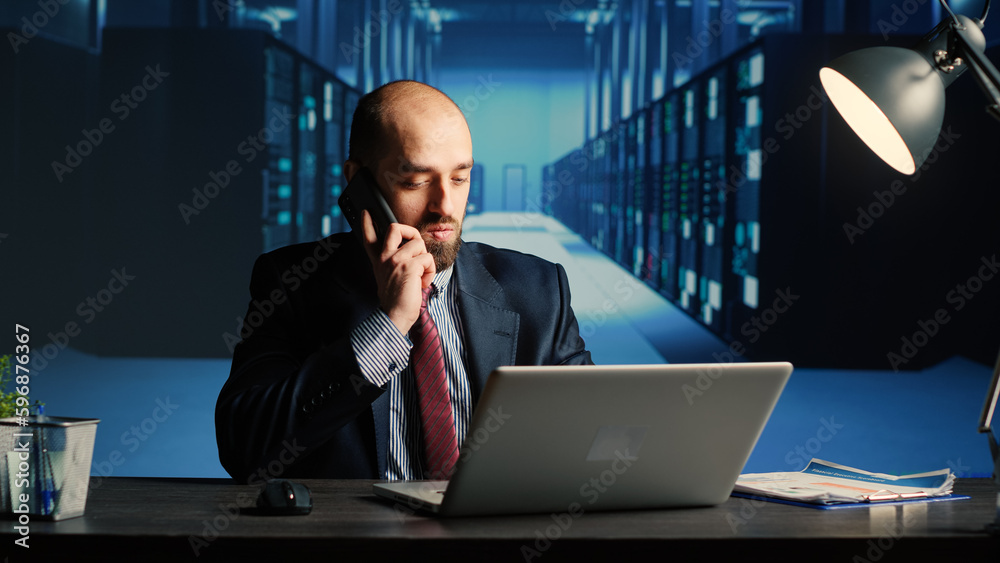 Poster information security officer answering phone call in server room, using big data and hardware for cl