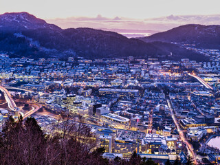 Arstad buildings lit up at dusk, Bergen, Norway