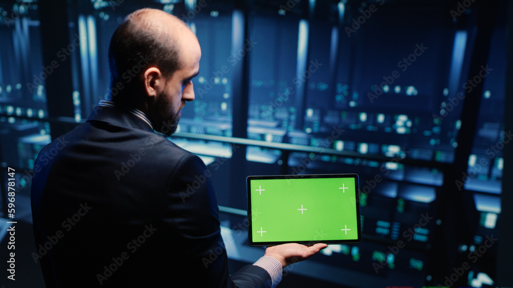 Poster it administrator running greenscreen display on tablet, using cloud computing in render farm. system