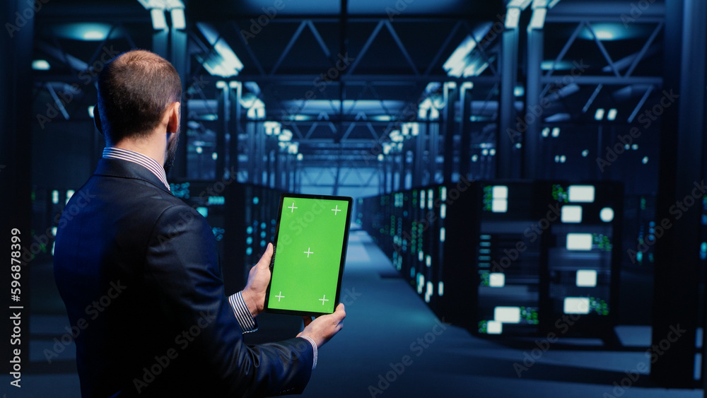 Poster database admin analyzing greenscreen display on tablet, doing web system check in server room. it en