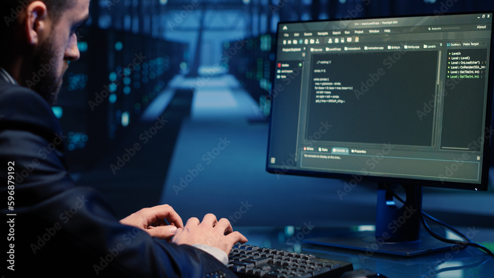 Poster database admin checking mainframe system on computer in data center, working with security protectio