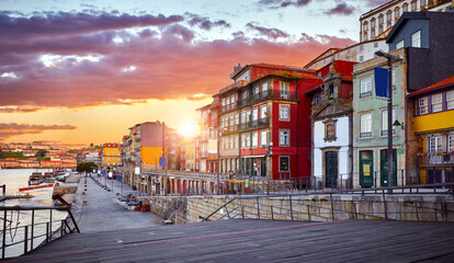 Porto, Portugal. Promenade in city porto over river Douro, with vintage authentic houses. Old cityscape sunrise and vibrant sunset evening sky