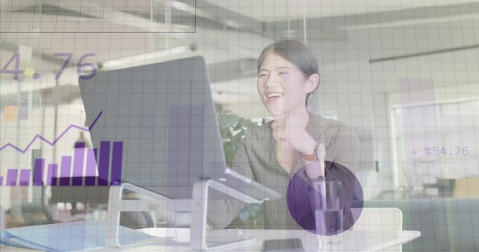 Animation of financial data processing over asian businesswoman using laptop at office