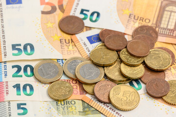 euro banknotes and coins top view 11