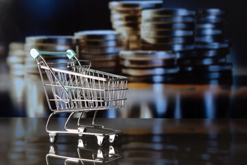 Supermarket trolley with out-of-focus appliquéd coin background