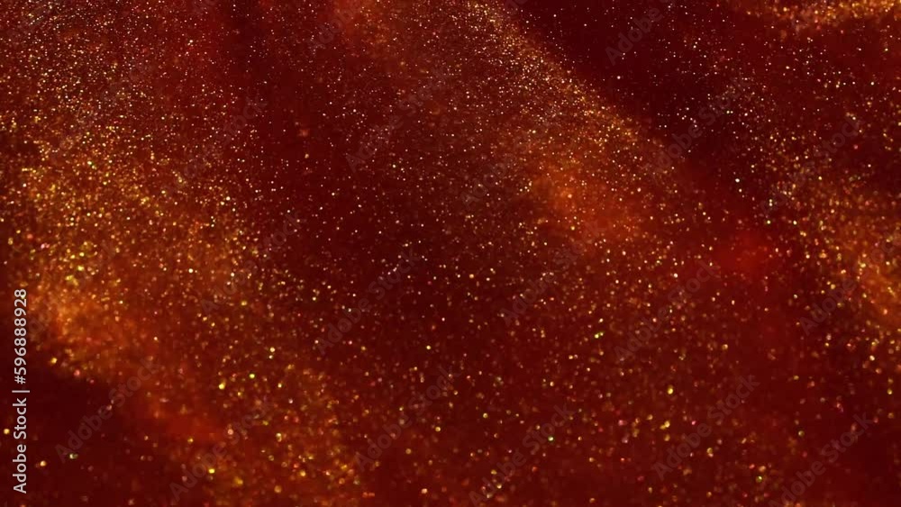 Wall mural falling jets of gold particles in red liquid. gold dust particles floating and flying apart in red f