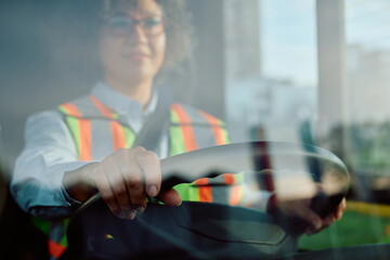 Close up of female bus driver.