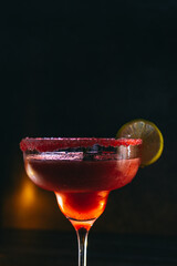 cocktail on a dark background with ice and fruits. menu format
