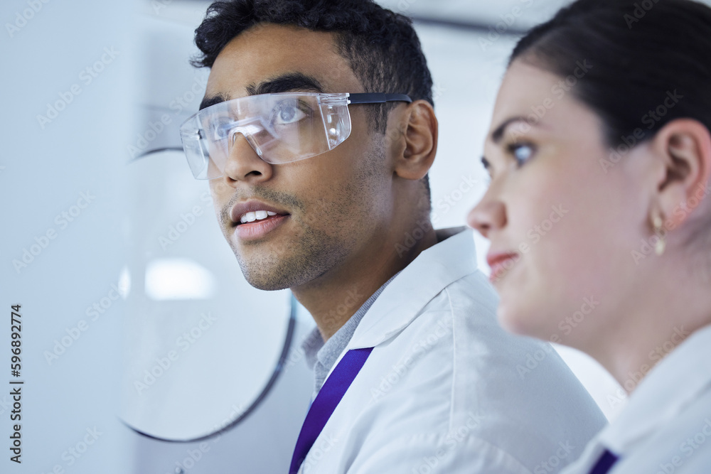 Aufkleber one step away from a miracle. shot of two lab workers removing samples from a storage facility.