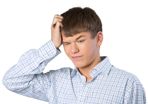 Teen male scratching his head