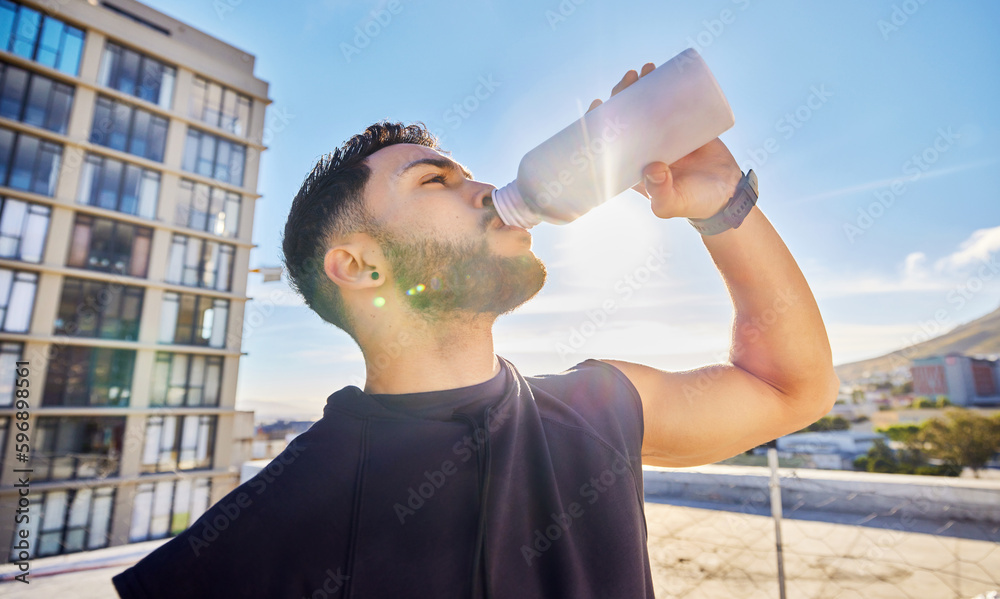 Canvas Prints if youre thirsty, you know you had a good workout. shot of a man drinking from a bottle while out fo