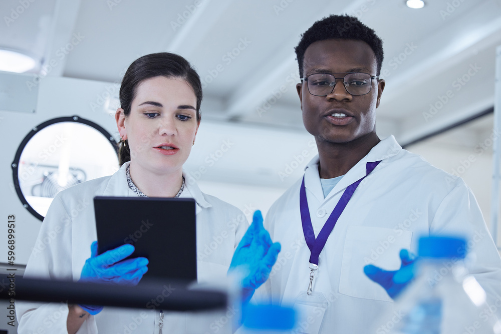 Poster A day of innovation. Shot of two colleagues working together on a scientific project using a digital tablet.