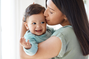 This is our love language. Shot of a mother bonding with her baby at home.