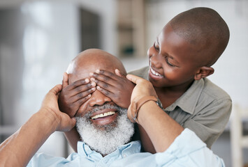 A happy family is but an earlier heaven. Shot of a boy and his grandpa bonding at home.
