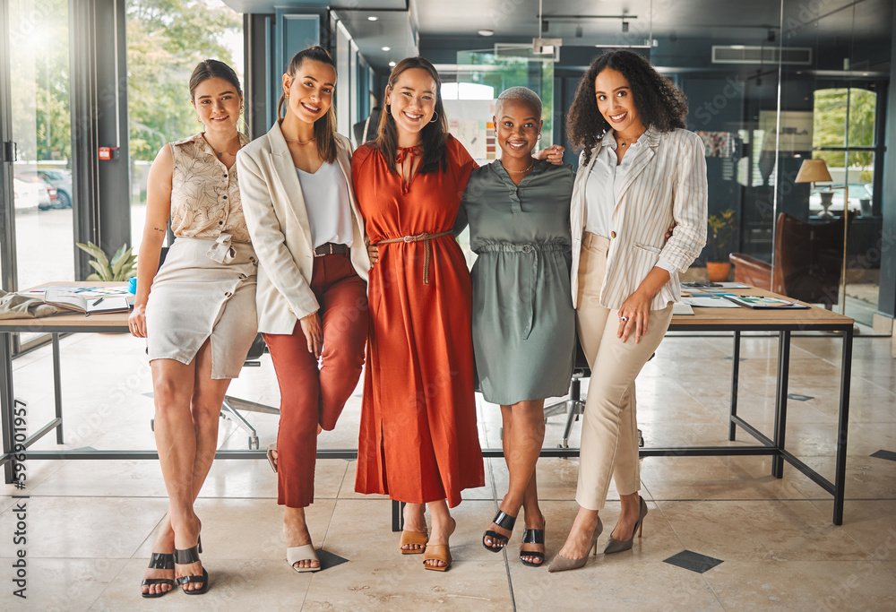 Wall mural Lets get together and work on something great. Shot of a group of female designers standing in an office.