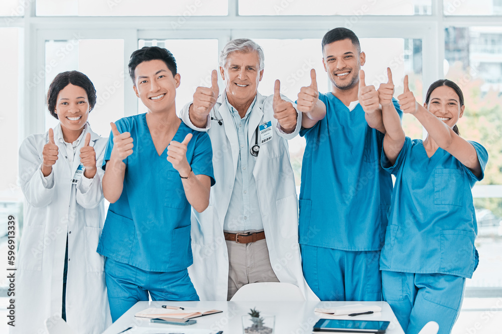 Poster as confident as they are capable. portrait of a group of medical practitioners showing thumbs up tog