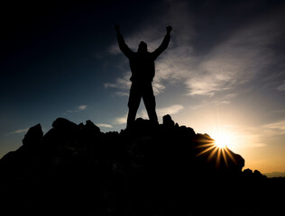 Man reaching the top of success in the mountain