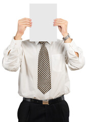 Businessman with paper in front of face