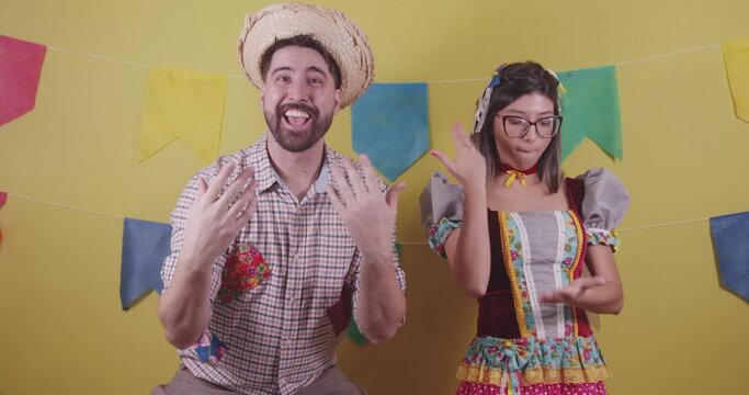 Brazilian couple, dressed in Junina party clothes, S&atilde;o Jo&atilde;o party. Protocol scenes.
