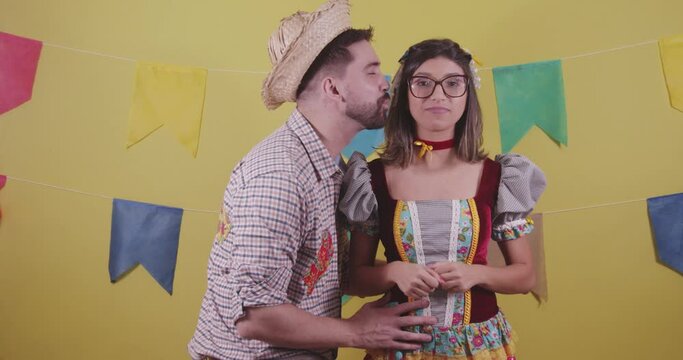 Brazilian couple, dressed in Junina party clothes, S&atilde;o Jo&atilde;o party. Protocol scenes.