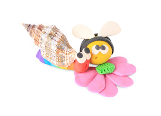 Bee with flower and snail made from plasticine on white background. Children's handmade ideas